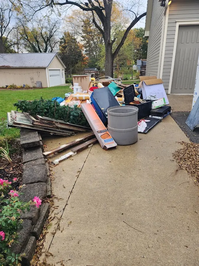 Dumpster being loaded with debris for 30 Yard Dumpster Rental in Shafter